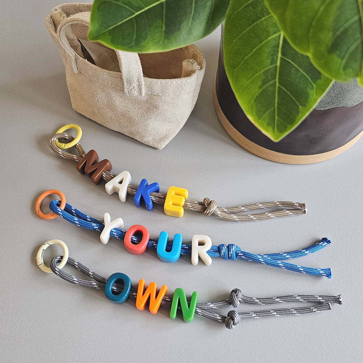 make your own event booth fringe activity Singapore Children's Day kids friendly alphabet bag charm DIY paracord keychain Family Day Product launch